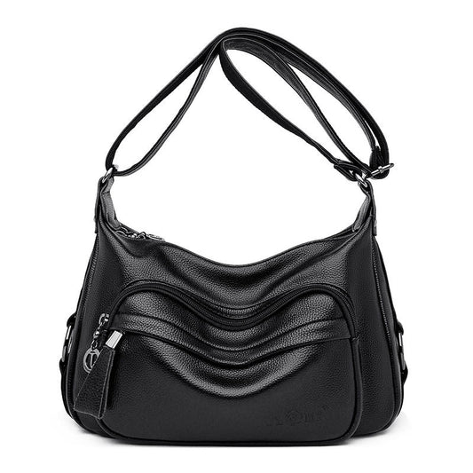 Black soft hobo shoulder bag with layered wave panels, front view