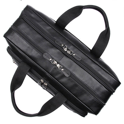 Top-down view of the black leather briefcase showing twin handles and zip closures